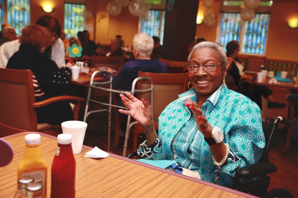 woman at dining facility in morning star village senior living in rockford, il